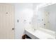 Double vanity bathroom with mirror and neutral walls at 2068 Lakewood Cir, Grayson, GA 30017