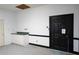Unfinished bonus room with green countertop and black door at 2068 Lakewood Cir, Grayson, GA 30017