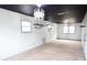 Spacious bonus room with gray carpet, black ceiling, and unique lighting at 2068 Lakewood Cir, Grayson, GA 30017