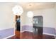 Dining room with hardwood floors and a unique chandelier at 2068 Lakewood Cir, Grayson, GA 30017