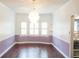 Formal dining room with hardwood floors and window seat at 2068 Lakewood Cir, Grayson, GA 30017