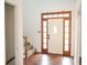 Bright entryway with hardwood floors and a white front door at 2068 Lakewood Cir, Grayson, GA 30017