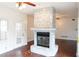 Stone fireplace in living room, hardwood floors at 2068 Lakewood Cir, Grayson, GA 30017