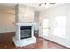 Stone fireplace in the living room with hardwood floors at 2068 Lakewood Cir, Grayson, GA 30017