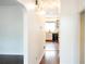 Hallway with hardwood floors offering a view of the kitchen at 2068 Lakewood Cir, Grayson, GA 30017