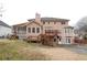Two-story house with deck, screened porch, and attached garage at 2068 Lakewood Cir, Grayson, GA 30017