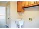 Laundry room with utility sink and cabinets at 2068 Lakewood Cir, Grayson, GA 30017
