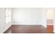 Bright living room featuring hardwood floors and white walls at 2068 Lakewood Cir, Grayson, GA 30017
