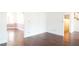 Spacious living room with hardwood floors and views into adjacent rooms at 2068 Lakewood Cir, Grayson, GA 30017