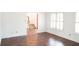 Living room with hardwood floors and staircase view at 2068 Lakewood Cir, Grayson, GA 30017