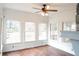 Bright sunroom with hardwood floors and multiple windows at 2068 Lakewood Cir, Grayson, GA 30017