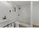 Bathroom with new marble shower, modern vanity, and natural light from the window at 951 Lawton Sw St, Atlanta, GA 30310