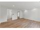 This bedroom has an open doorway to the bathroom and a view of the interior and wood floors at 951 Lawton Sw St, Atlanta, GA 30310