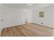 Bright bedroom featuring neutral color palette, laminate flooring, and natural light at 951 Lawton Sw St, Atlanta, GA 30310