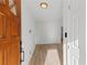 Open doorway that reveals new wood floors throughout the home with neutral paint at 951 Lawton Sw St, Atlanta, GA 30310
