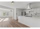 Updated kitchen with stainless steel appliances, white cabinets, quartz counters and laminate floors at 951 Lawton Sw St, Atlanta, GA 30310