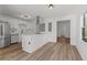 Bright kitchen with stainless steel appliances, white cabinets and eat-in island at 951 Lawton Sw St, Atlanta, GA 30310