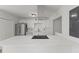 Open kitchen features quartz counters, modern appliances and cooktop on island with seating at 951 Lawton Sw St, Atlanta, GA 30310