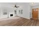 Open living room featuring a fireplace, ceiling fan and lots of natural light at 951 Lawton Sw St, Atlanta, GA 30310