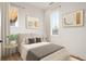Cozy bedroom with neutral tones, large windows, and stylish decor at 10931 Serenbe Ln, Chattahoochee Hills, GA 30268