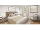 Cozy bedroom features a comfortable bed, decorative pillows, modern artwork, and natural light at 10931 Serenbe Ln, Chattahoochee Hills, GA 30268