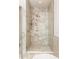 The large shower has marble tile and glass door at 10931 Serenbe Ln, Chattahoochee Hills, GA 30268