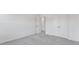 Neutral bedroom featuring a large closet with bi-fold doors and light gray carpet at 3269 Durston Ct, Dacula, GA 30019