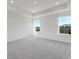 Spacious bedroom with plush carpeting, recessed lighting, and two windows at 3269 Durston Ct, Dacula, GA 30019