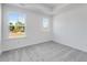 Light-filled bedroom with two windows and plush carpeting at 3269 Durston Ct, Dacula, GA 30019