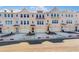 New townhomes boast painted brick facade, individual garages, and inviting front entryways at 3269 Durston Ct, Dacula, GA 30019