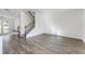 Spacious living room features hardwood floors, stairs, and an open floor plan at 3269 Durston Ct, Dacula, GA 30019