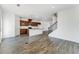 Open-concept living room featuring hardwood floors and a modern kitchen with a center island at 3269 Durston Ct, Dacula, GA 30019