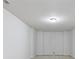 Clean basement with neutral carpet, a simple light fixture, and potential for customization at 2420 Bronze Ct, Cumming, GA 30041