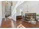 Formal dining room with hardwood floors, wainscoting, coffered ceiling, and chandelier at 2420 Bronze Ct, Cumming, GA 30041