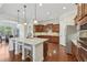 Gourmet kitchen featuring granite countertops, stainless steel appliances, and a large center island with breakfast bar at 2420 Bronze Ct, Cumming, GA 30041