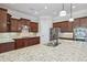 This kitchen features granite countertops, stainless steel appliances, and a center island at 2420 Bronze Ct, Cumming, GA 30041