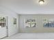 Neutral living room featuring bright light and multiple windows and a door at 2420 Bronze Ct, Cumming, GA 30041