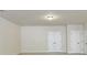 Neutral living room featuring bright light and multiple windows and doors at 2420 Bronze Ct, Cumming, GA 30041