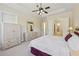 Main bedroom featuring tray ceiling, sitting area, and a light and airy feel at 2420 Bronze Ct, Cumming, GA 30041