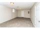 Finished basement with tile flooring, painted walls, and a window at 407 Robins Nest Ct, Woodstock, GA 30189