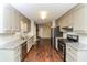 Galley kitchen with gray cabinets, granite countertops and stainless steel appliances at 407 Robins Nest Ct, Woodstock, GA 30189