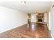 Open-concept living area features wood floors and a stone fireplace at 407 Robins Nest Ct, Woodstock, GA 30189