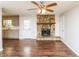 View of the kitchen and fireplace from the living area at 407 Robins Nest Ct, Woodstock, GA 30189