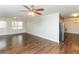 Open layout featuring wood floors and a view of the kitchen and stainless steel appliances at 407 Robins Nest Ct, Woodstock, GA 30189