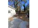 The backyard includes a concrete patio, a lawn mower, and some sparse landscaping at 1905 Robinhill Ct, Tucker, GA 30084