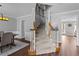 Elegant foyer featuring a staircase with wooden banisters and hardwood floors at 2352 Shore View Ct, Suwanee, GA 30024