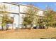 Private backyard with small deck and mature trees at 4262 Buford Valley Way, Buford, GA 30518
