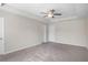 Large bedroom with ceiling fan and neutral decor at 4262 Buford Valley Way, Buford, GA 30518