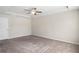 Spacious bedroom with neutral walls and ceiling fan at 4262 Buford Valley Way, Buford, GA 30518