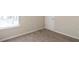 Carpeted bedroom with window and neutral walls at 4262 Buford Valley Way, Buford, GA 30518